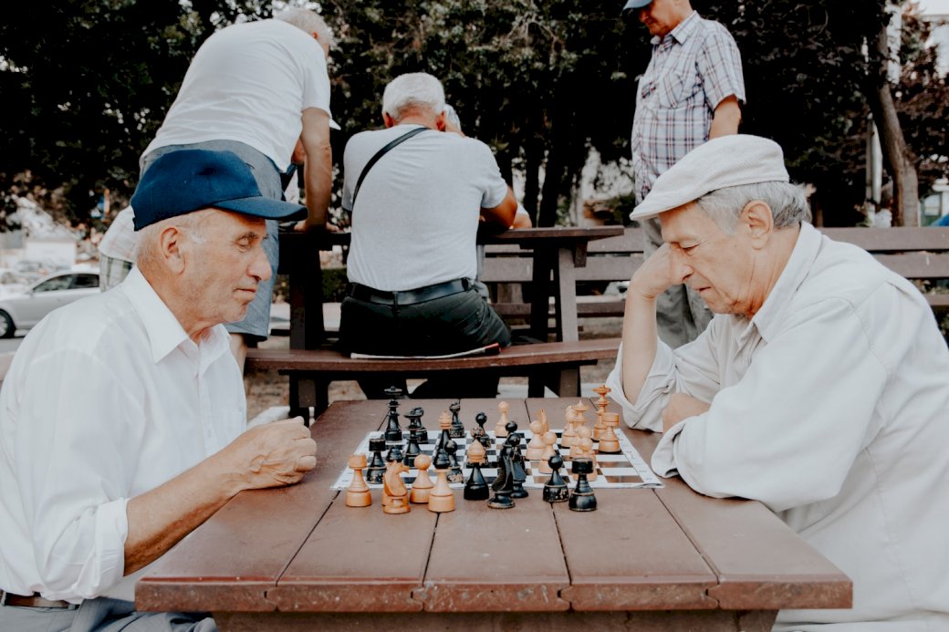 Two men playing chess puzzle online