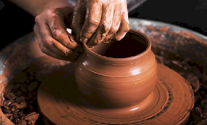 Hands Of A Potter Creating An Earthen Jar puzzle online