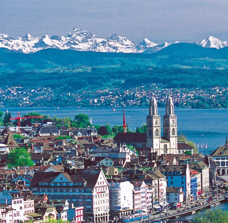 Zurych z Jeziorem Zuryskim i górską panoramą puzzle online