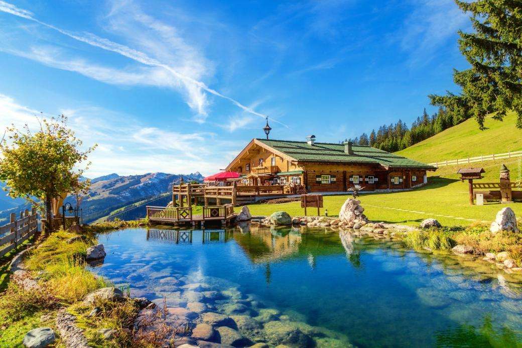 dom w górach nad rzeką puzzle online