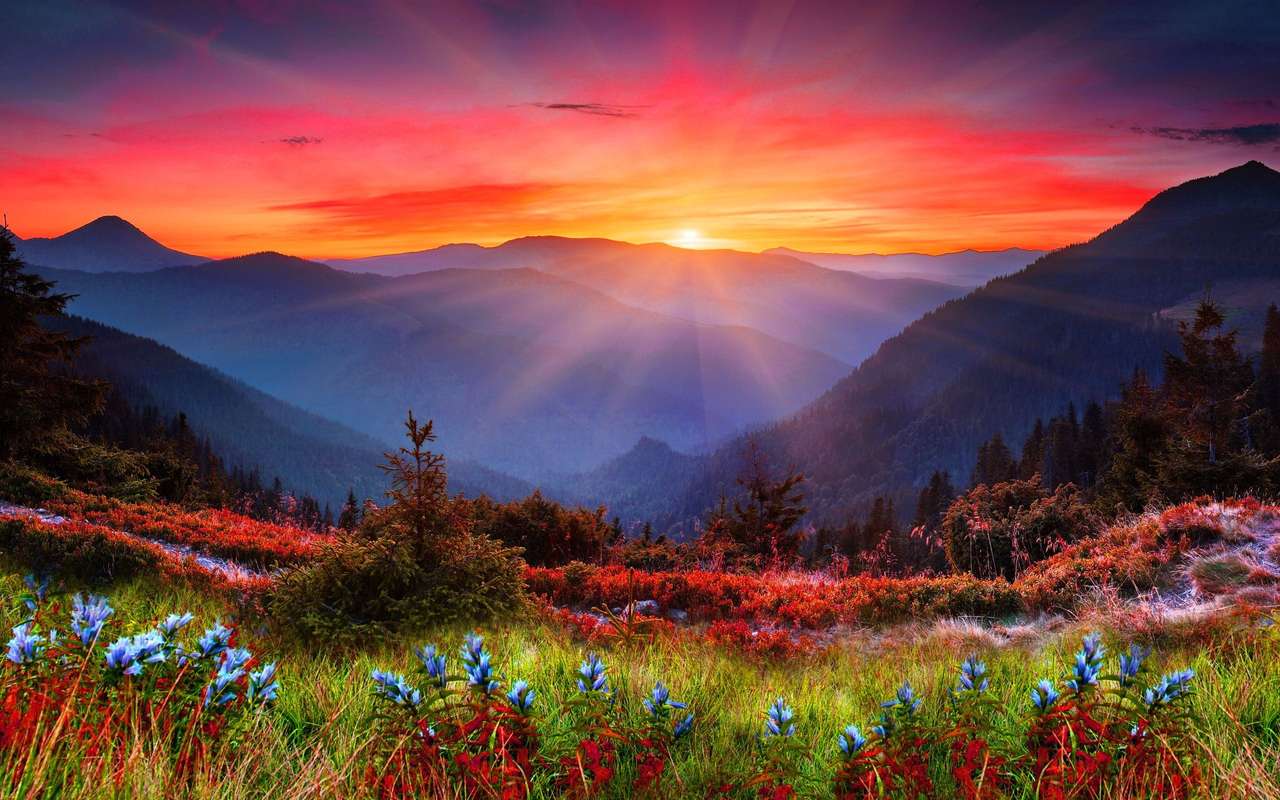 Zachód słońca w górskim krajobrazie puzzle online