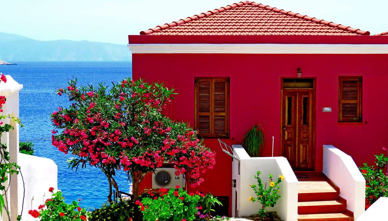 Czerwony dom z widokiem na morze puzzle online