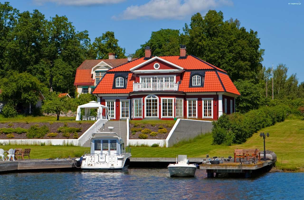 dom przy jeziorze z przystanią puzzle online