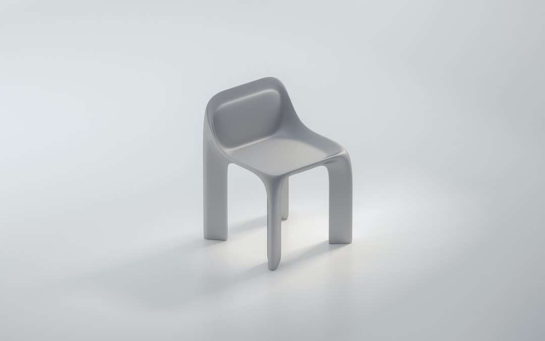 białe plastikowe krzesło na białej powierzchni puzzle online