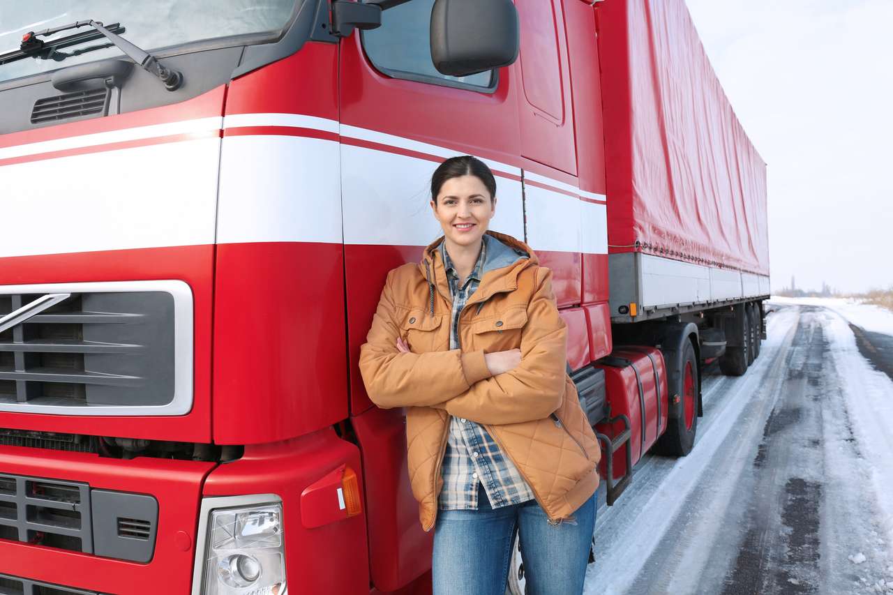 Kobieta kierowca w pobliżu dużej ciężarówki puzzle online