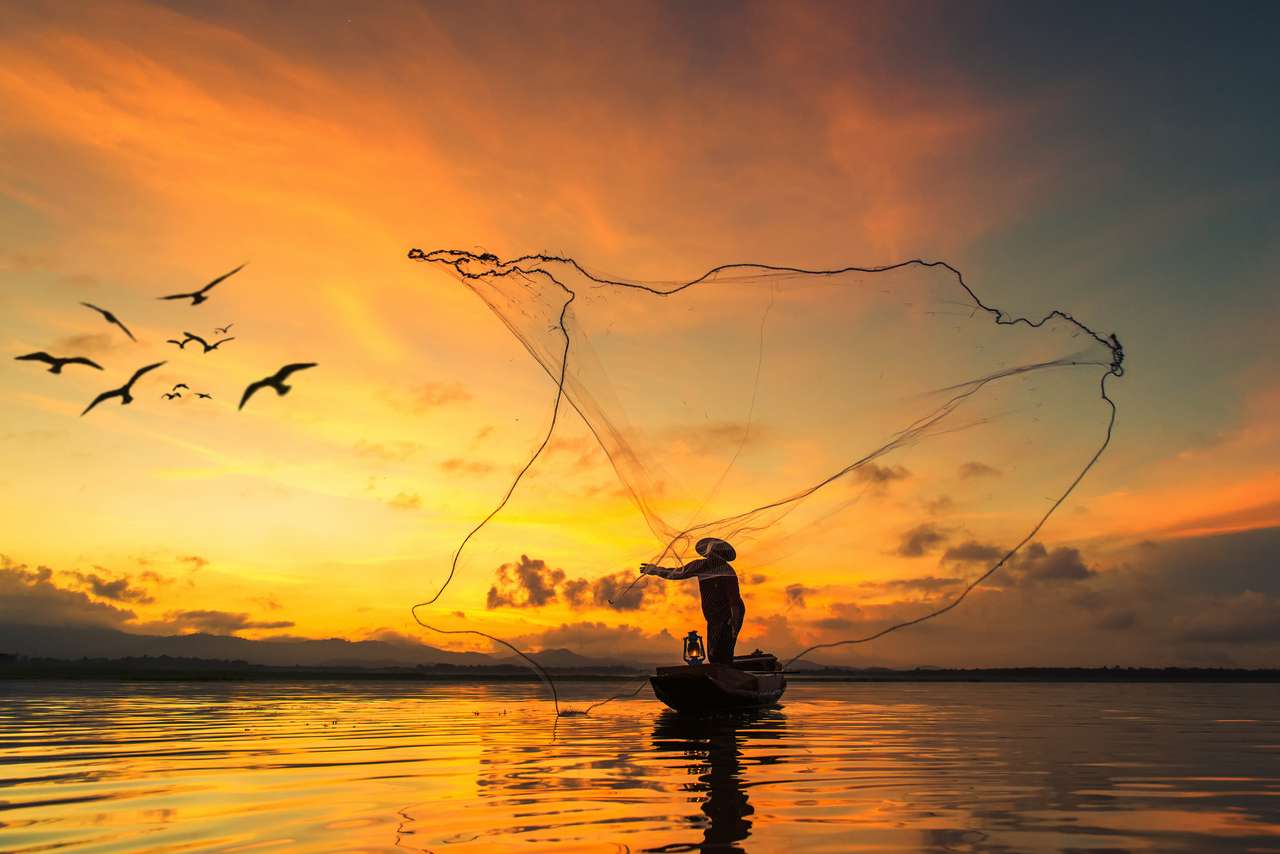 Fisherman fishing at lake in Morning, Thailand. puzzle