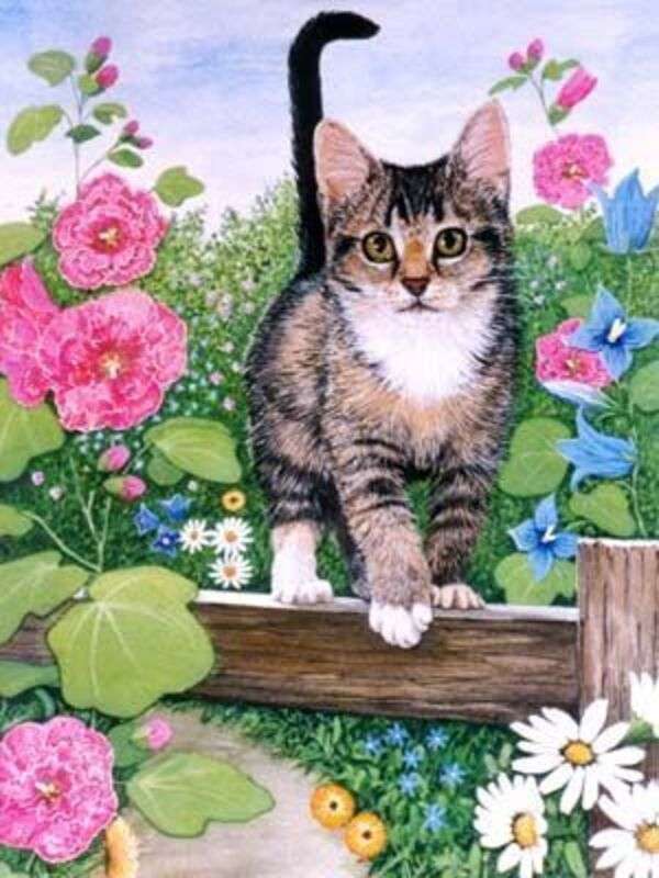 Kotek w ogrodzie wśród kwiatów puzzle online