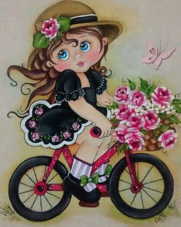 Mała dziewczynka w czarnym garniturze na rowerze z bukietem kwiatów puzzle online