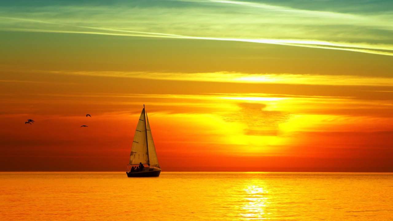 piękny zachód słońca w morzu puzzle online