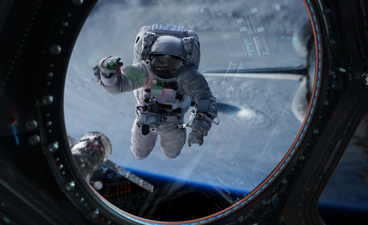 Astronauta w kosmosie pracujący na stacji kosmicznej puzzle online