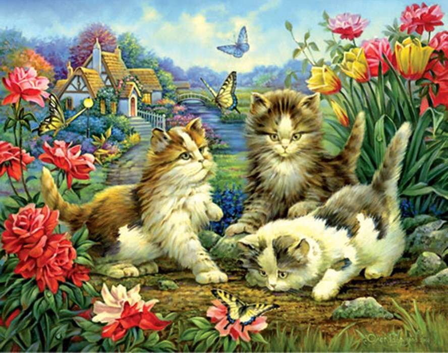 trzy kocięta w ogrodzie puzzle online