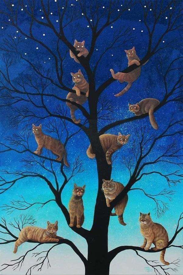 Koty na drzewie światełka puzzle online