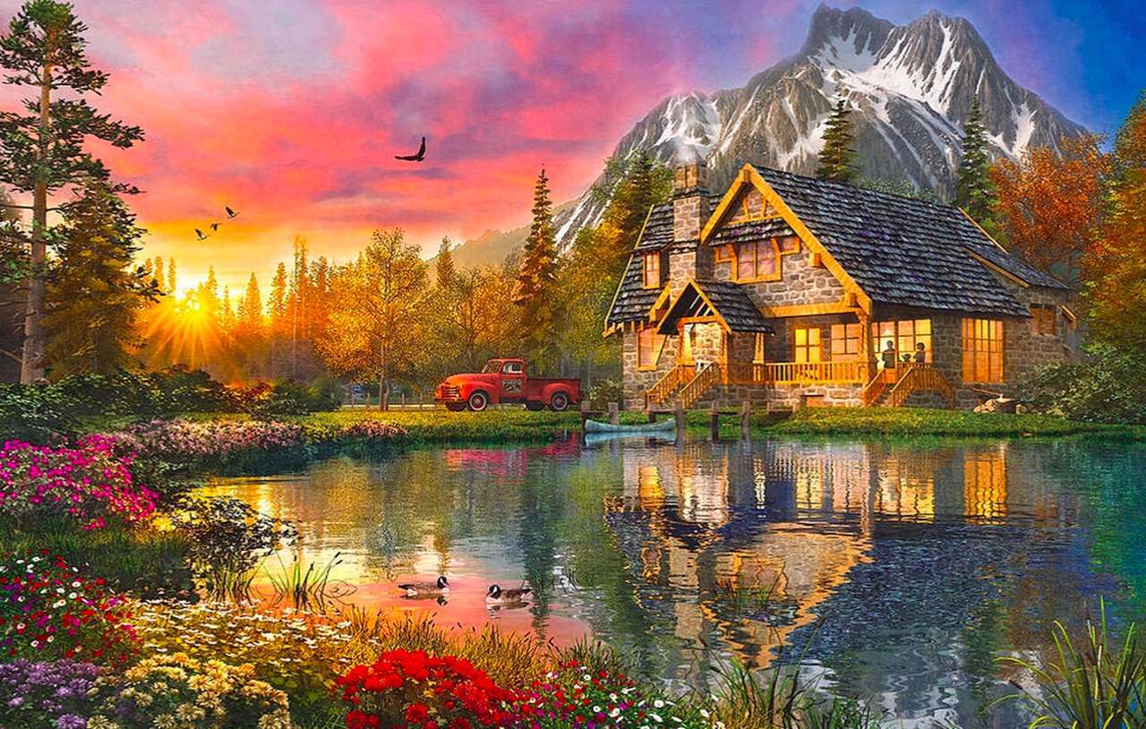 Dom nad jeziorem w górach wieczorem puzzle online