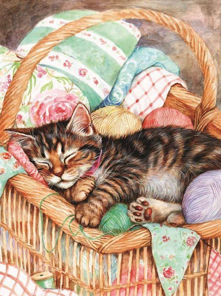 Kociak śpiący w swoim koszyku puzzle online