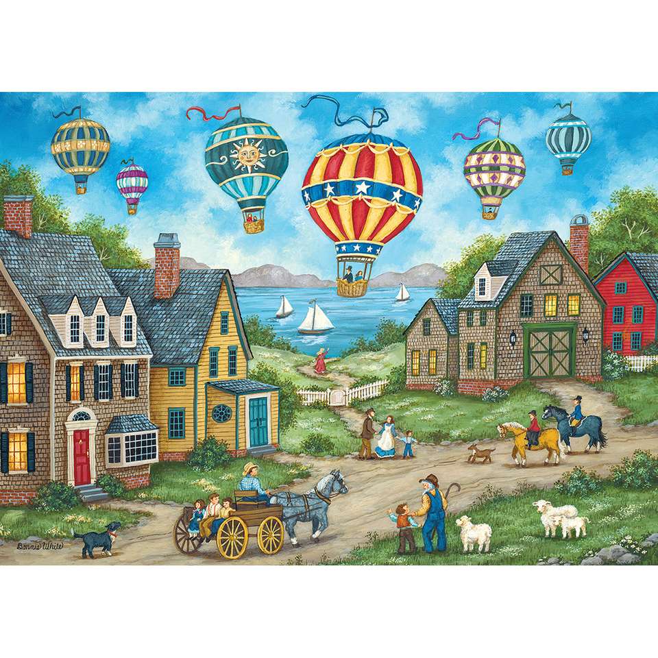przelot balonów na ogrzane powietrze nad wioską puzzle online