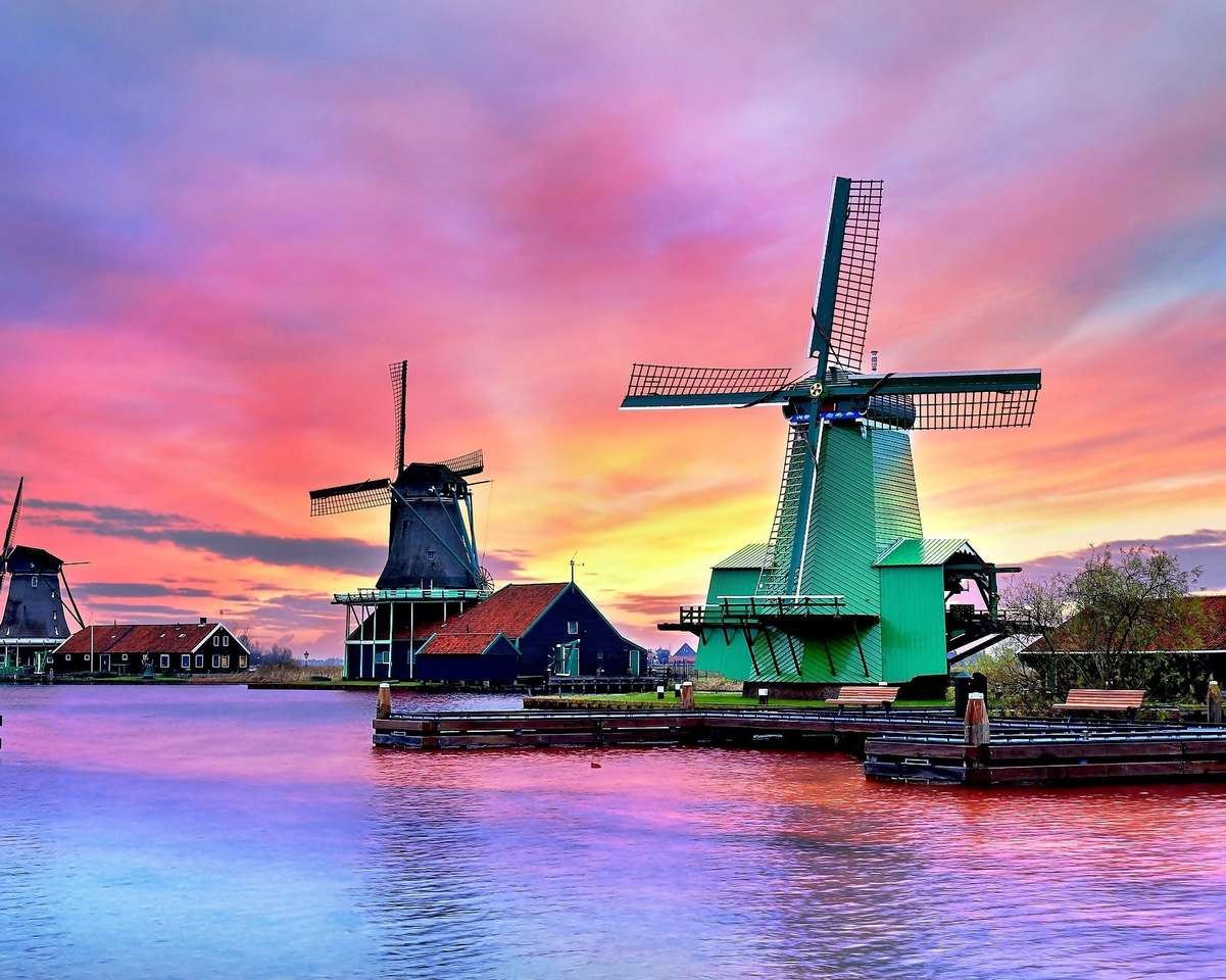 Wiatraki nad rzeką o zachodzie słońca w Holandii puzzle online
