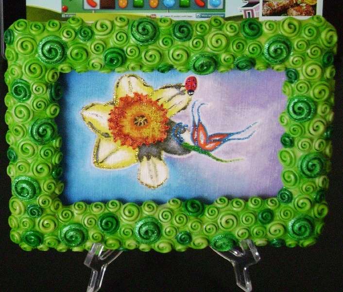 kwiat, motyl i biedronka z dekorowaną ramą puzzle online