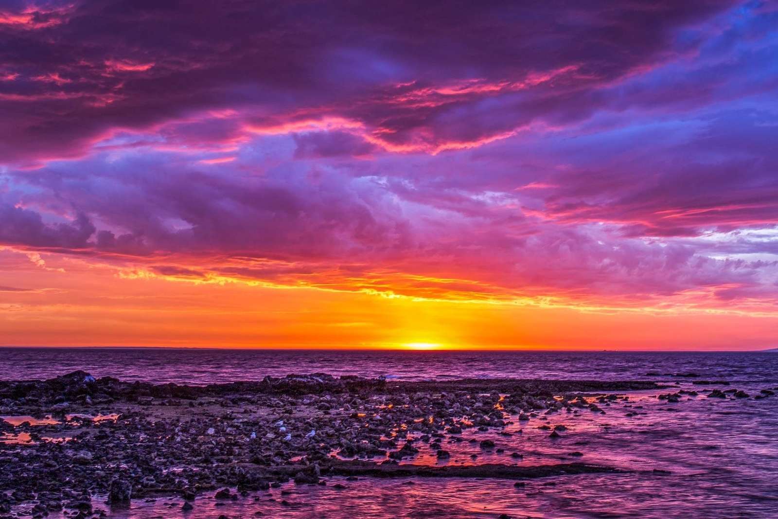 przepiękny zachód słońca nad morzem puzzle online