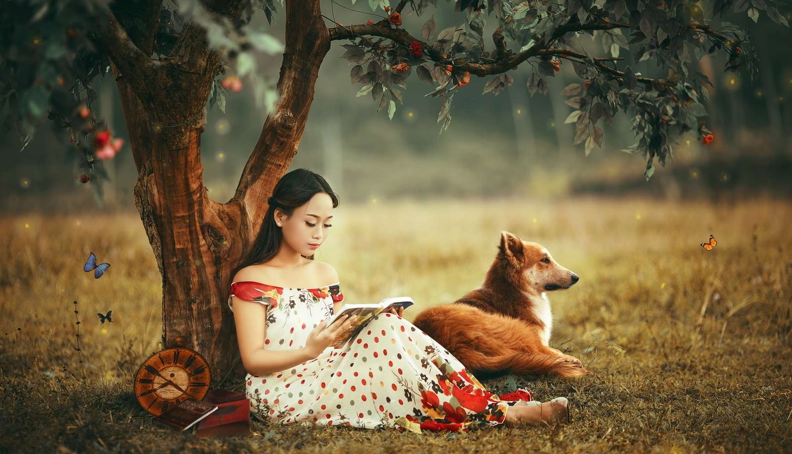 Dziewczyna z książką i psem pod drzewem puzzle online