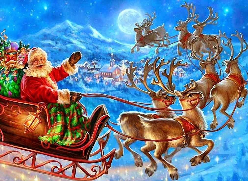 Mikołaj na saniach z prezentami puzzle online